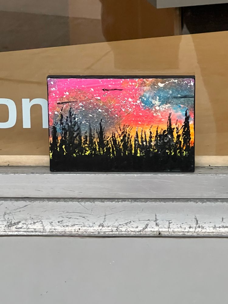 Small landscape painting on a Windowsill. 
