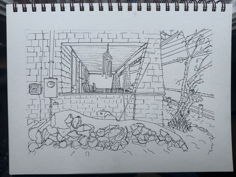  A completed pen sketch of the craftsman house in winter with wood pile