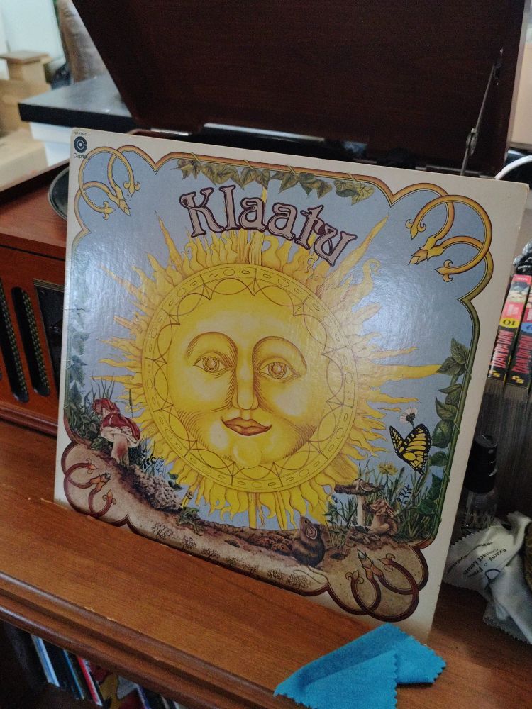 A picture of a vinyl record leaning on a record player. It is Klaatu's "3:47 EST". It is an obscure Canadian band most famous for a rumor that they were a secret Beatles Reunion project.