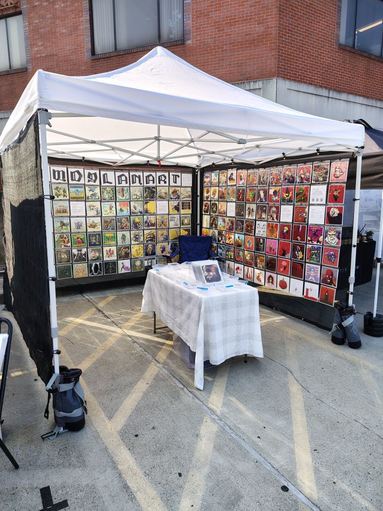 Another view of the art fair tent, showing a different wall.
