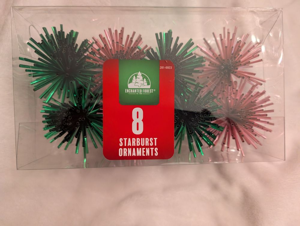 Pink and green Christmas ornaments that look like torture devices. 