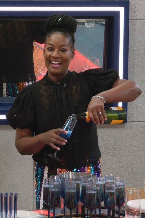 Cirie pouring champagne on BB25 premiere