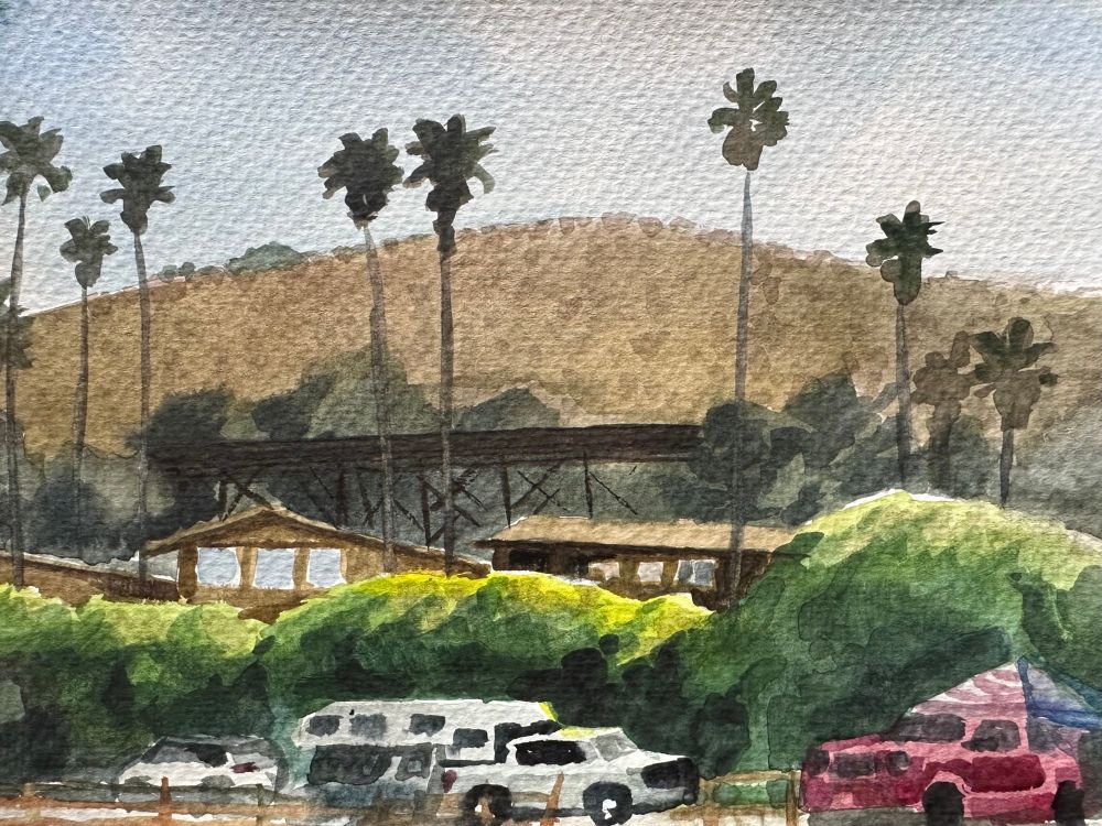 View of train tracks along hill, and campers underneath. Painted plein air from campsite at Jalama beach