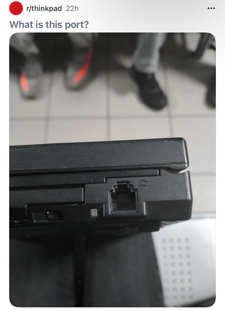 Screenshot of a Reddit post in r/thinkpad. Title reads “what is this port?” With a photo to of the Ethernet port on the side of their laptop. 