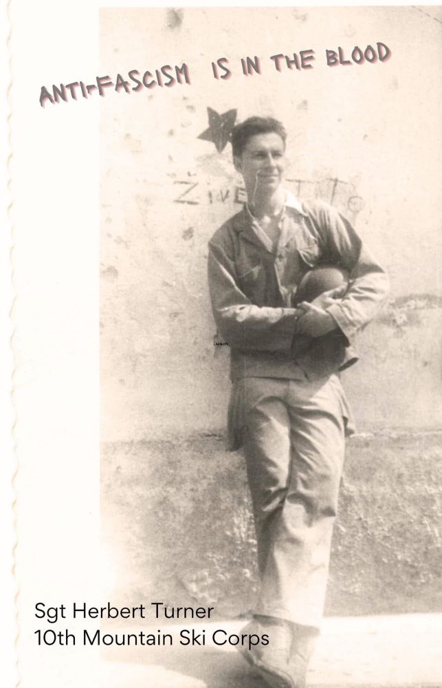 World War Two soldier leaning against a stone wall in the Italian Po Valley with his helmet tucked under one arm
