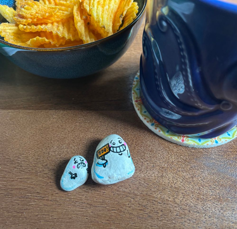 The stones out of their bag, sat on my table next to my cup of tea in an octopus mug (cos why not) and a small bowl
Of tasty tasty bbq pork crisps.