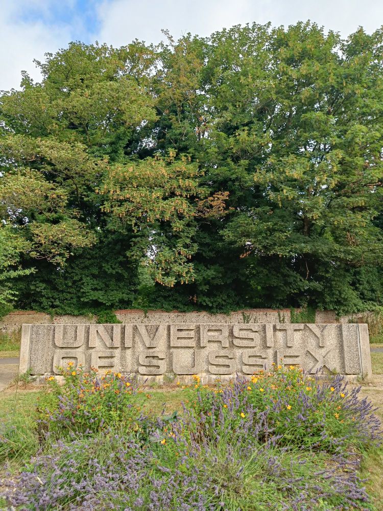 The entrance sign at the University of Sussex 