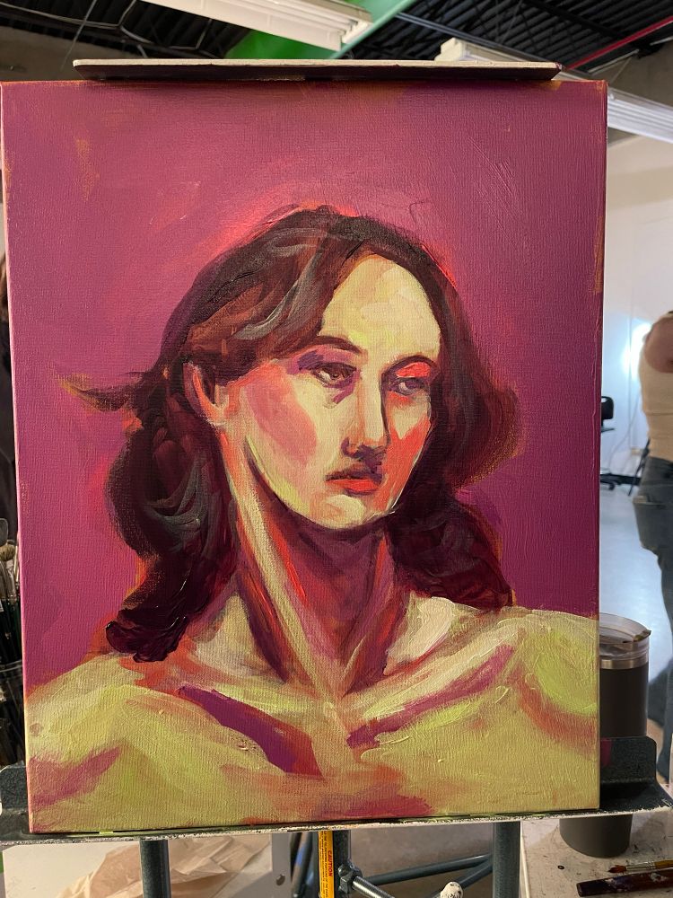 You can see a bit of the classroom where this painting was made. 
The portrait has more shadows and is all most done, though the background is just a solid color 