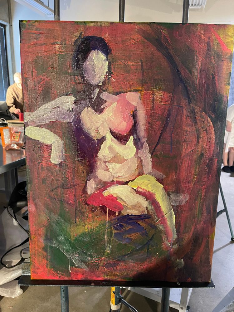 A blocky human woman figure, the colors are a mix of red, light green and purple 