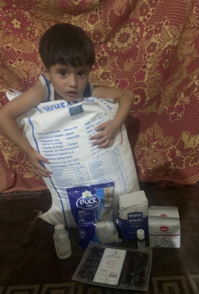 omar with various bags of food and medicine