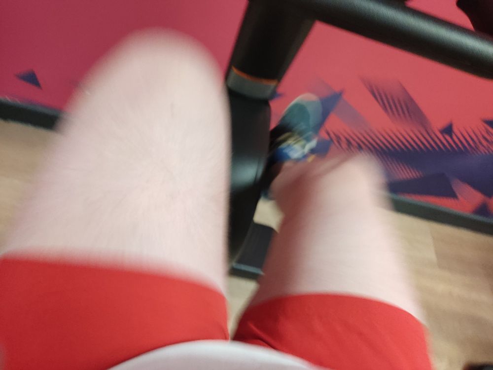 Motion blurred picture of my lower body using a cardio bike