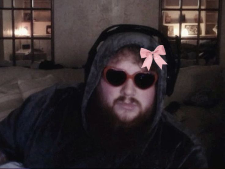 Caseoh with heart shaped glasses and a bow 