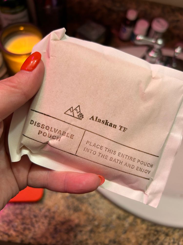 White pouch labeled “Alaskan tf. Dissolvable pouch.”