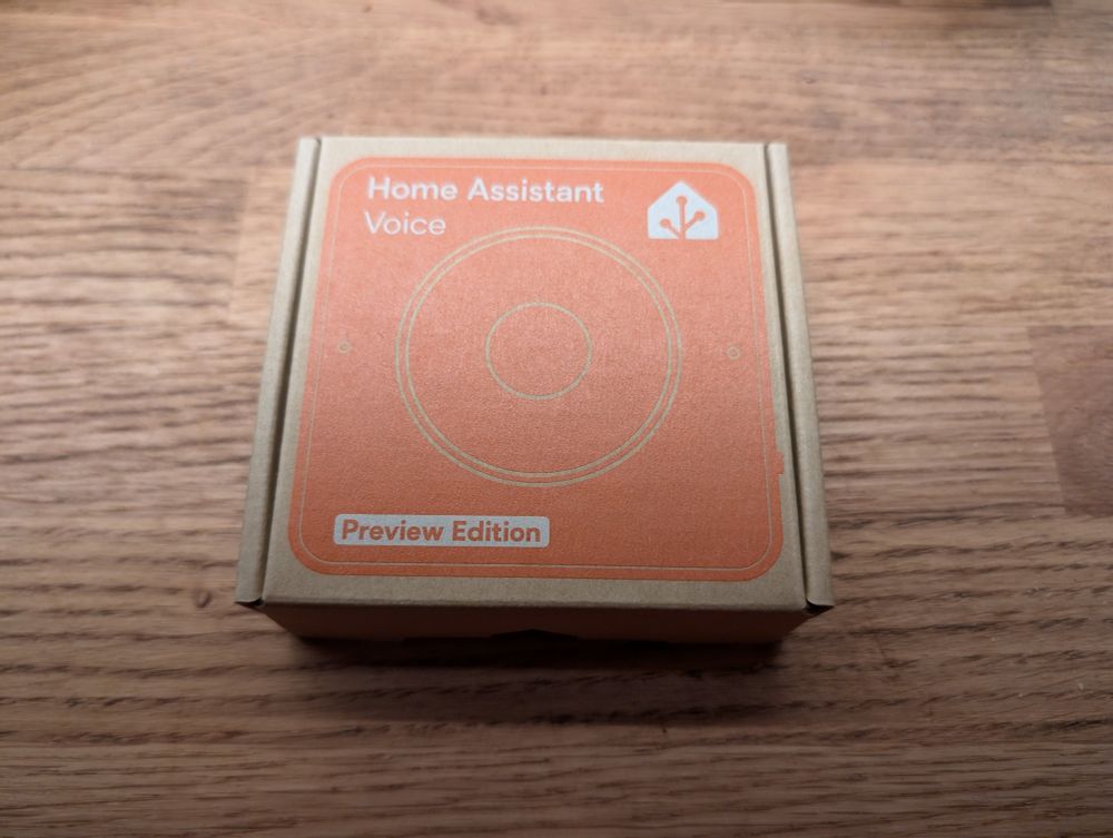 A photo of an unopened brown box labelled Home Assistant Voice Preview