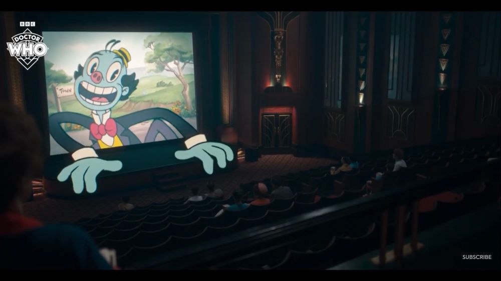 An animated figure in the style of 1920s animation crawls out of the screen in a dark theatre in the trailer for Doctor Who Season Two (2025)