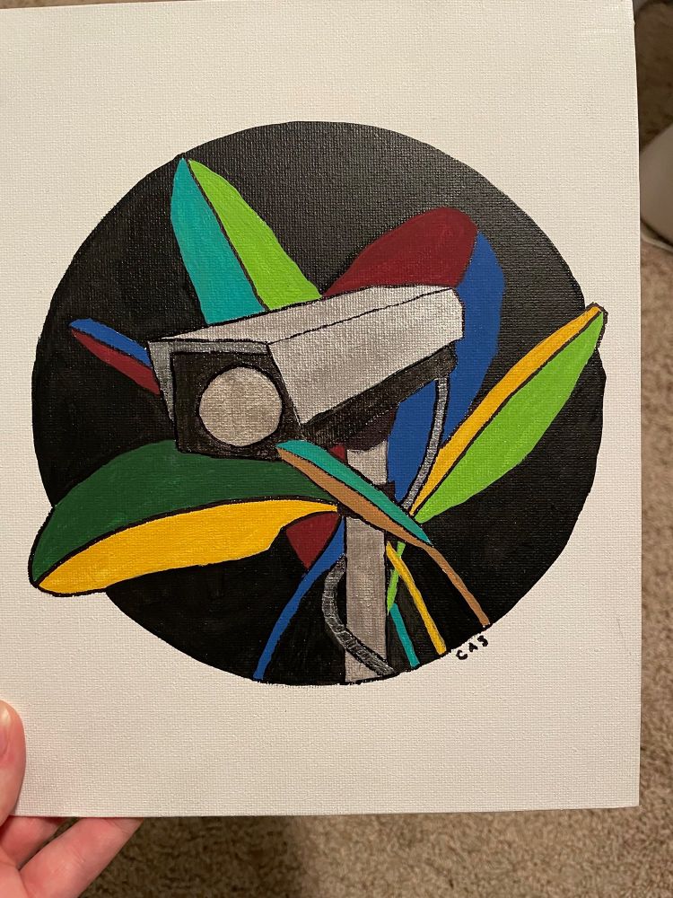 Painting of surveillance camera in leaves
