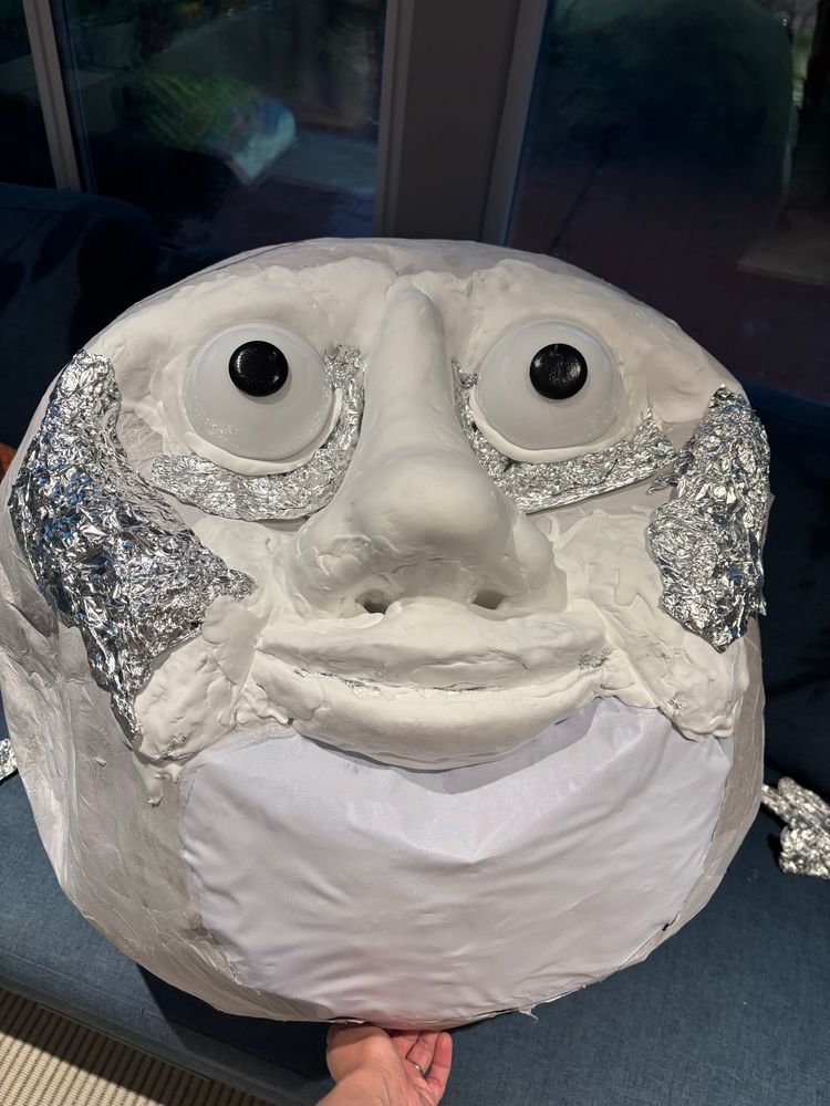 The ego orb now has pupils and foam clay is covering some of the foil to make the face. 