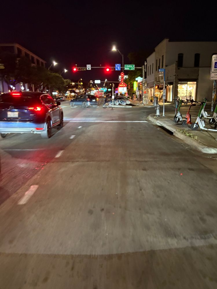 Picture of a bike lane that widens as it meets an intersection