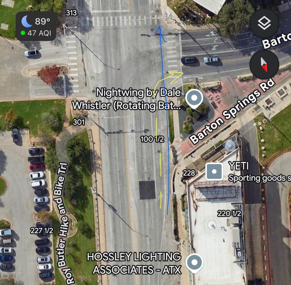 Screenshot of an intersection with arrows showing how the right turn lane and the bike lane interact/overlap