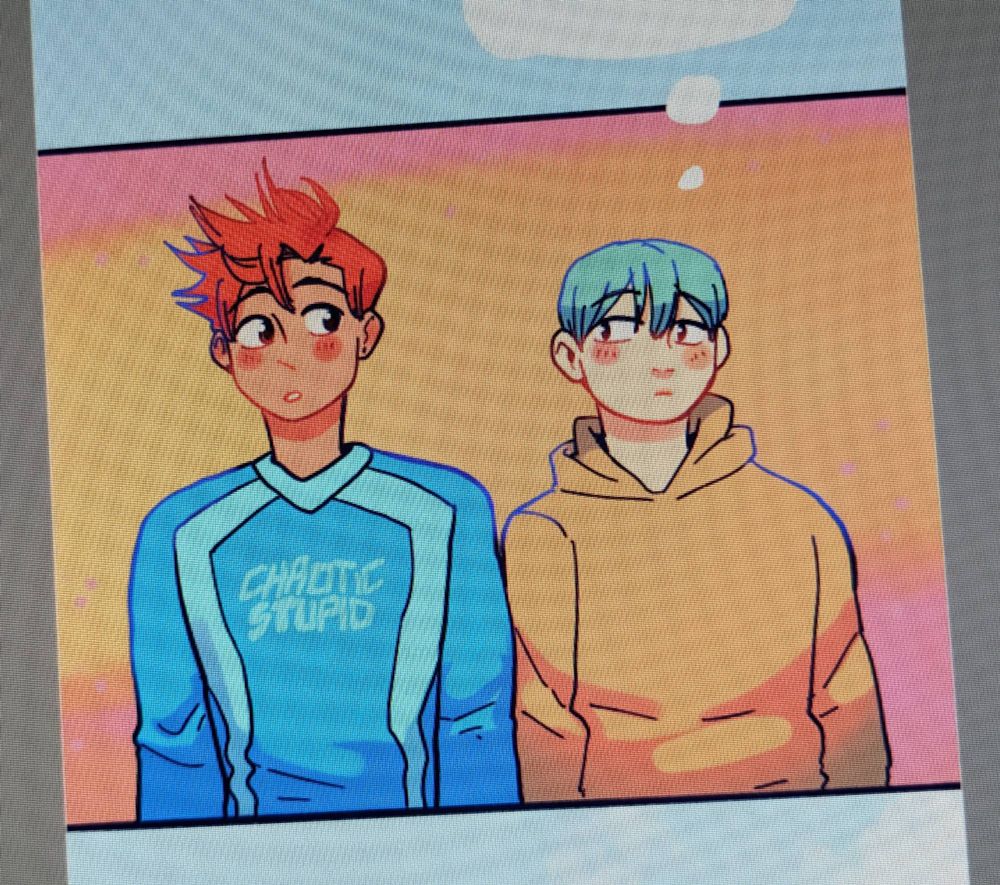 Panel of my webcomic colors. Jae and Greg standing next to each other and looking sideways at each other 