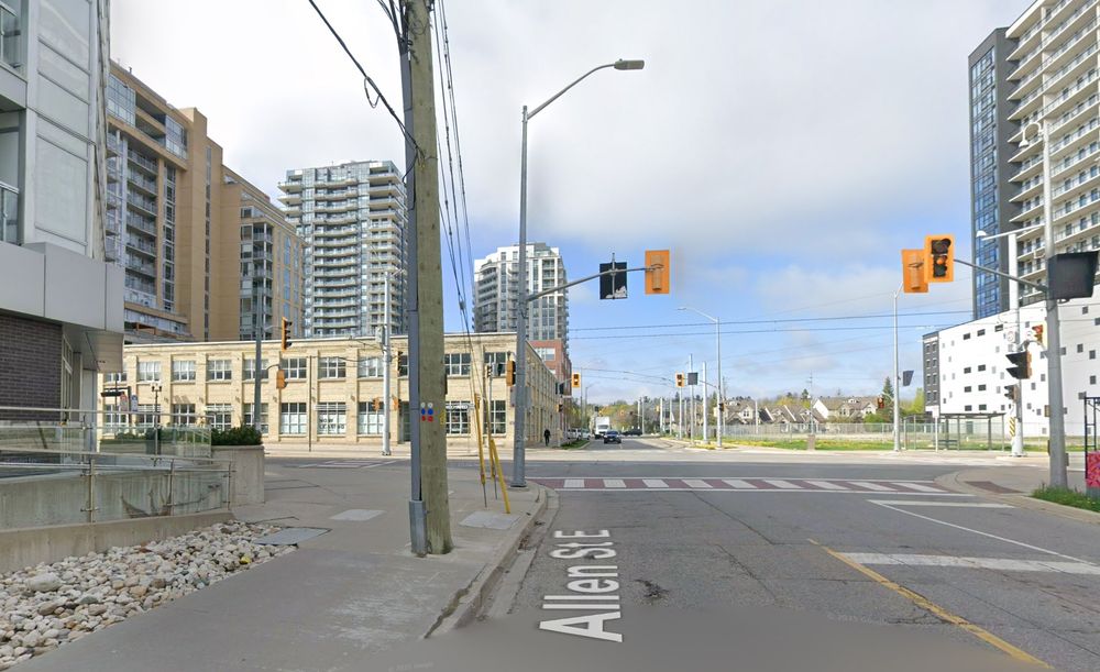 Same spot with light rail tracks. There's on balance more buildings in the shot, the overhead wire for light rail, but the power lines dive underground when crossing the tracks, and are underground along King St. Overall there's fewer wires
