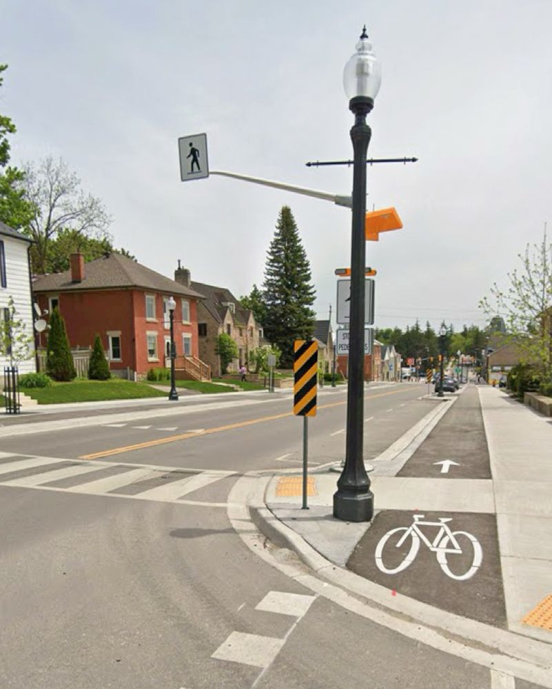 Protected one way bike lane on a low density small town street