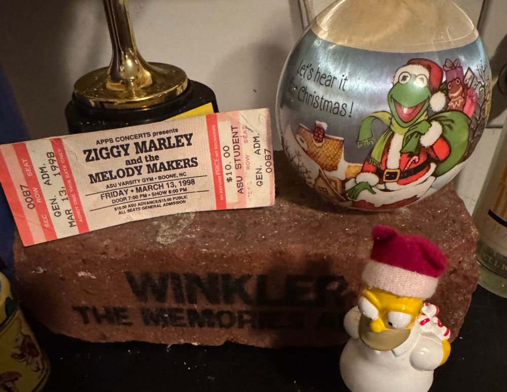Ziggy Marley ticket AppState on top of a brick from my demolished dorm. This was taken at Christmas so Homer and Kermit are also out to spread good cheer.