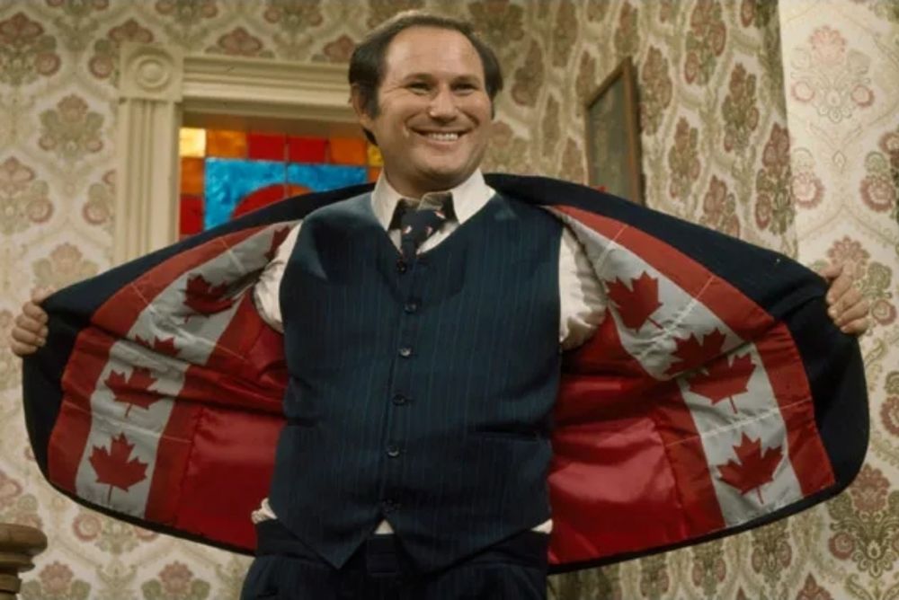 'King of Kensington' standing proud, while holding his jacket open revealing Canadian flags stitched on the liner of his jacket. 



