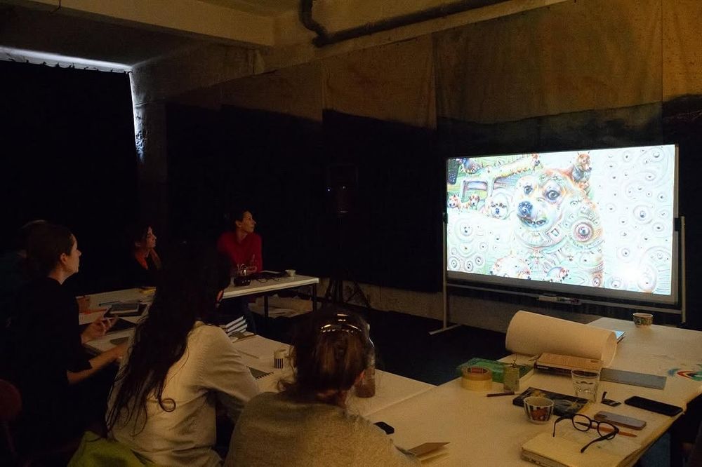 Video projection of a talk by Rosemary Lee with a projected image of an AI hallucination by DeepDream Photo: Vera Carmo