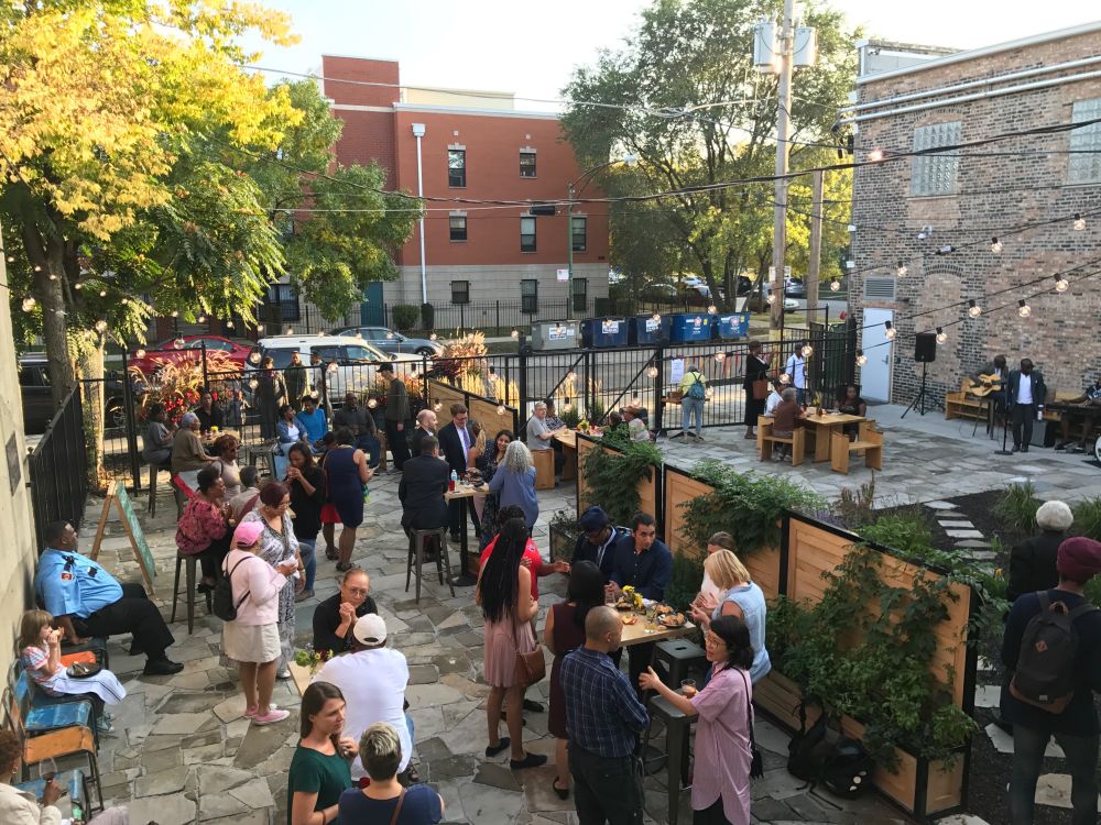 People gather at the Washington Rain Garden in Chicago, IL.