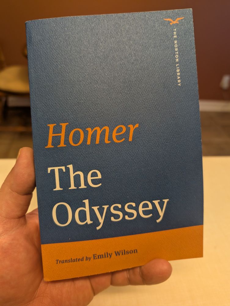 The blue and orange cover of the Norton Library edition of The Odyssey by Homer,  translation by Emily Wilson.