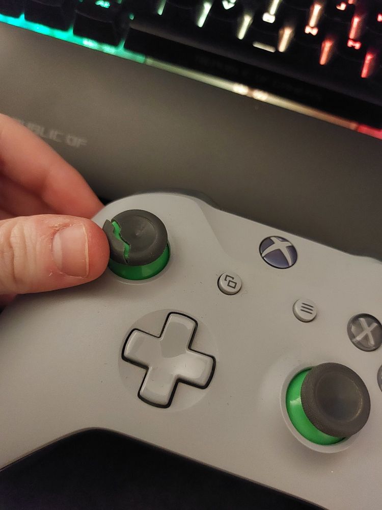 Xbox controller with the left joystick pad shown ripped in half.
