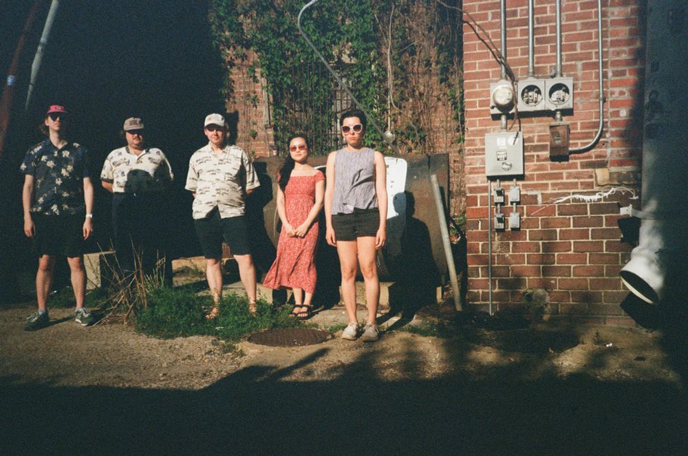 Visiting my buddy in Oxford Mississippi. Five people loosely gather in an alley.