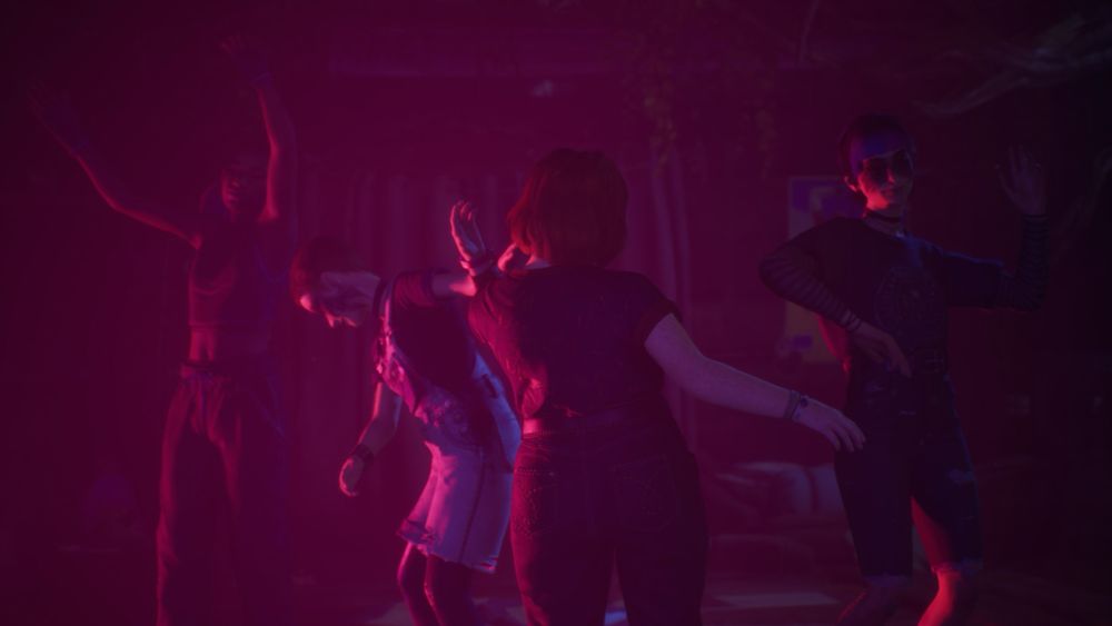 Four girls dance in pink lighting