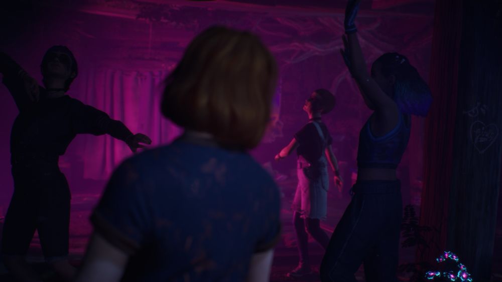 Four girls dance in pink lighting again