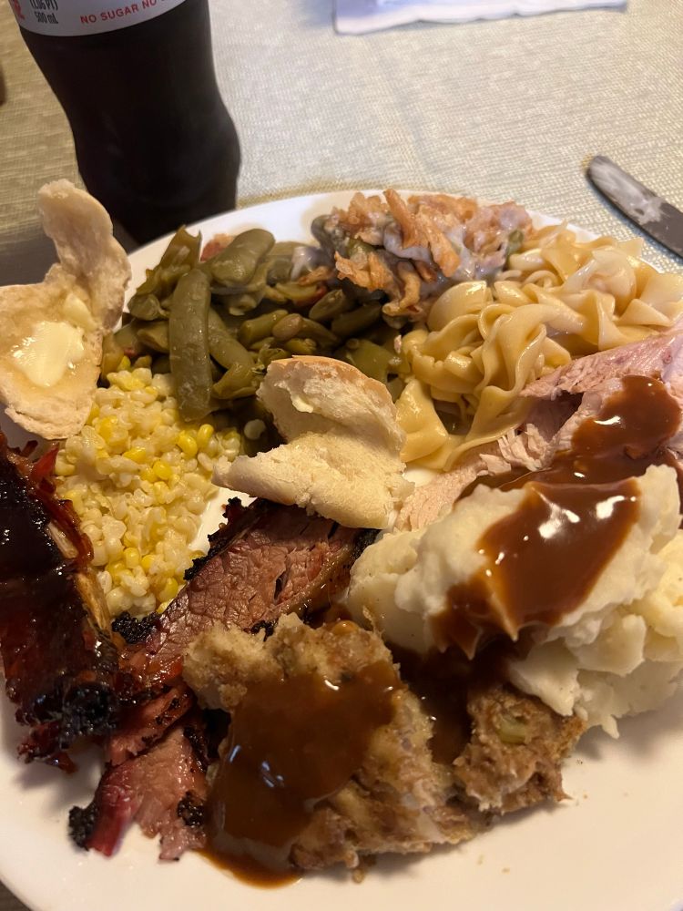 A ridiculous amount of food. Turkey, ribs, brisket, mashed potatoes, green beans, noodles, green bean casserole, stuffing, corn, yeast rolls. Not shown: deviled eggs.