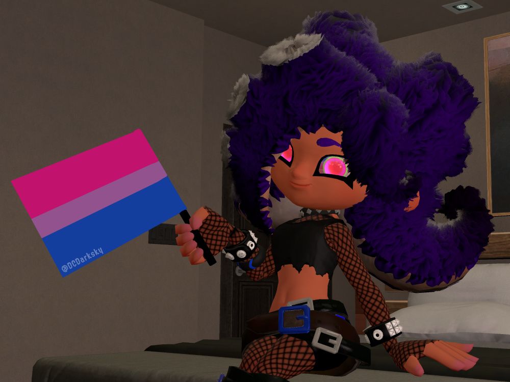 Fate Allottee holding up a bisexual flag cuz she likes both men and women