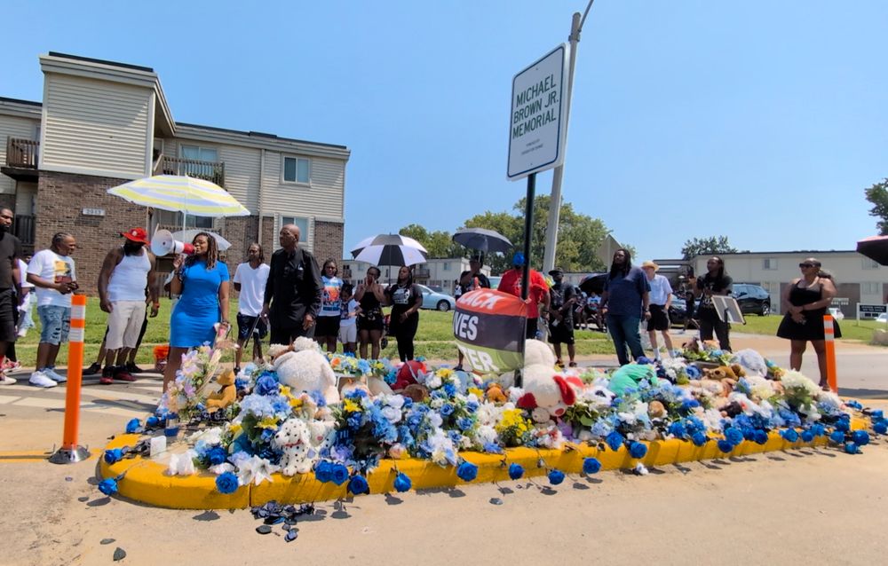 Former U.S. Congresswoman Cori Bush addresses a gathering of Mike Brown's family & supporters at the Michael Brown Jr. Memorial on Canfield Dr in Ferguson, MO on the 11th anniversary of his death.