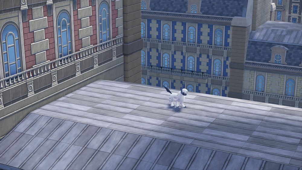 A screenshot from Pokémon Legends ZA of an Absol standing on a distant roof