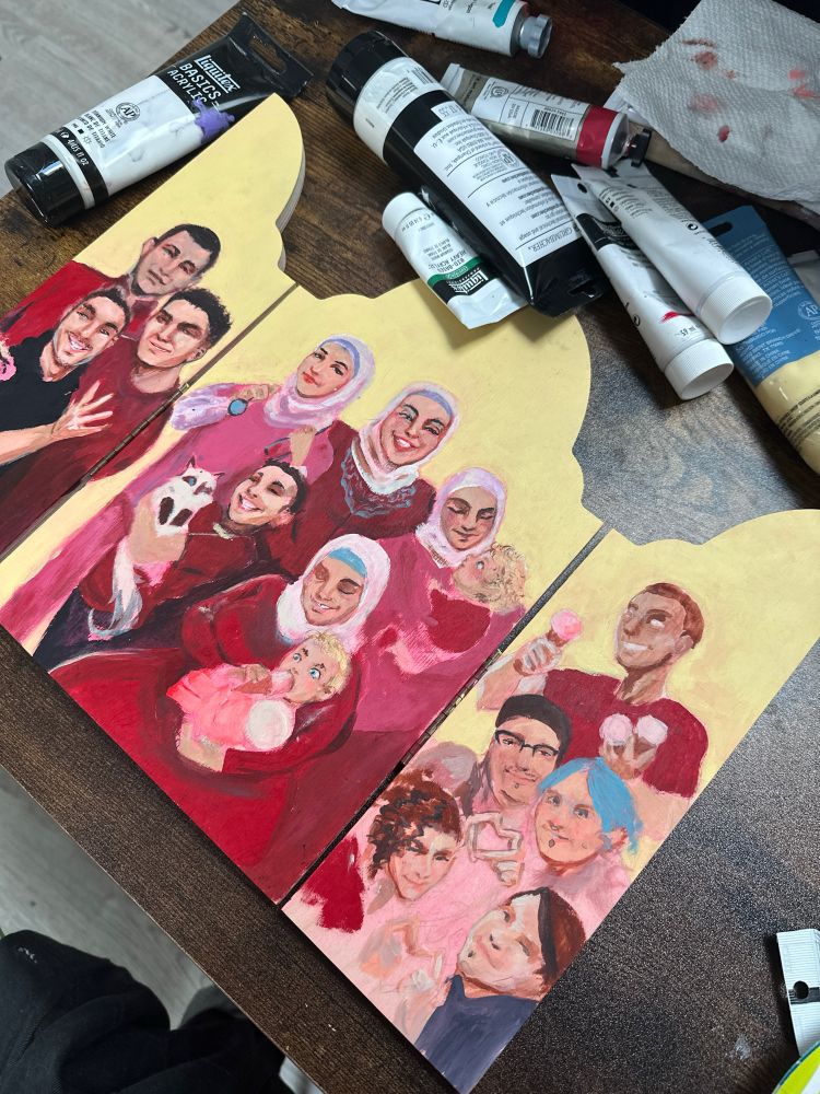 A wip painting of Noor Al Shara’s family and friends 