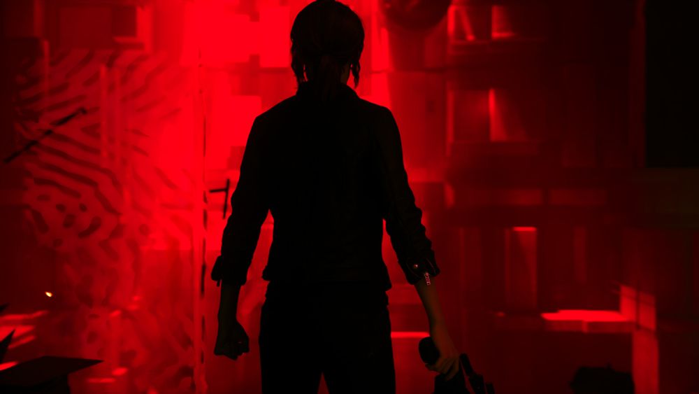 Jesse Faden standing in front of the red light that the hiss emit 