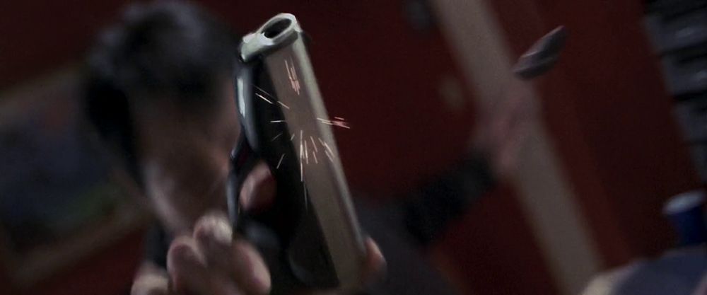 Yulaw deflecting a bullet with his gun. 