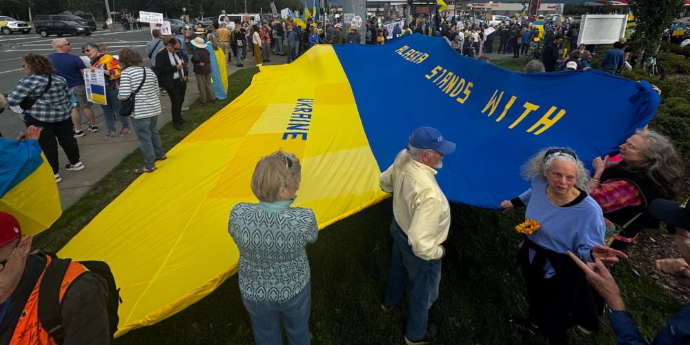 Protesters gathered in both Anchorage and Fairbanks on Thursday, one day before President Trump and Russian President Vladimir Putin arrive on Elmendorf Airforce base on Friday.