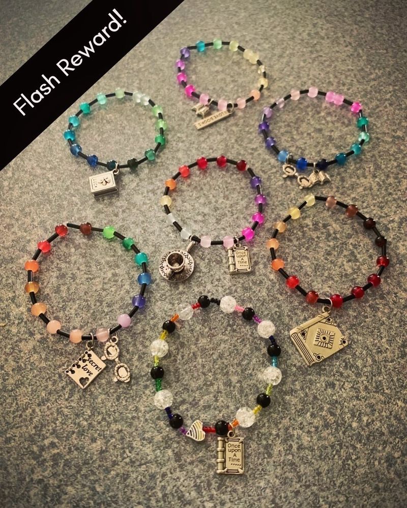 “Flash reward” next to an image of rainbow stretch bracelets with metal book charms 