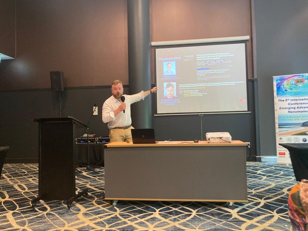 Presentation, highlighting key students working on piezoelectric polymers.