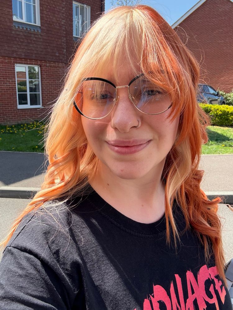 It’s Fran! Her usual hair (ginger with the blonde panels / pieces) but with a deeper orange. It’s been professionally curled. 