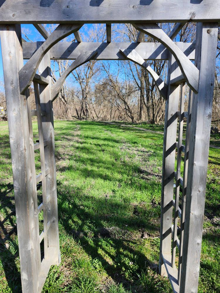 A wooden trellis and garden