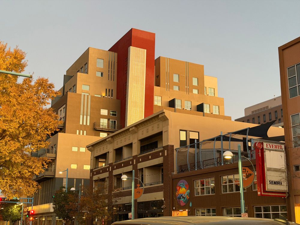 Building catching the early evening sunlight in a very nice way, some red elements and some metallic, I don’t know the correct terms for any of this