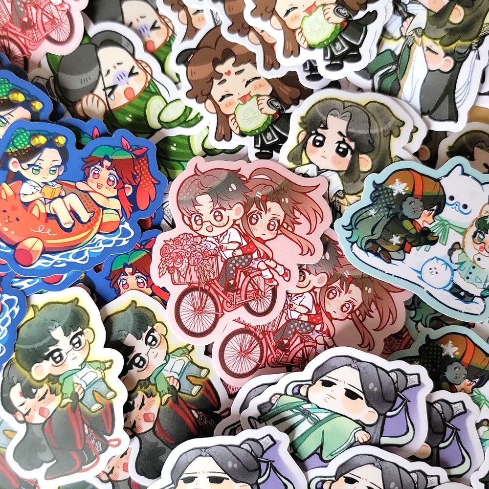 an assorted pile of bingqiu and bingyuan stickers. in the middle is a spring love-themed bingyuan sticker with shen yuan on a bike and binghe holding him from behind. a bundle of flowers sit inside the bike's basket.