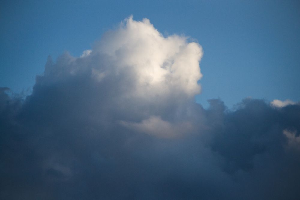 Just a classic cloud partially illuminated by the late-day sun.